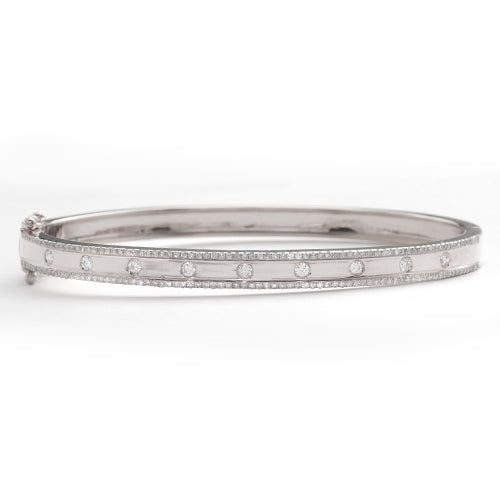 14KW 0.70CTW DIAMOND BANGLE - 9 STONE CENTER ROW